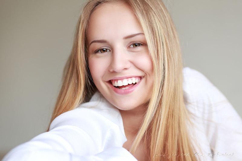 headshot of beautiful teen girl smiling with big toothy smile